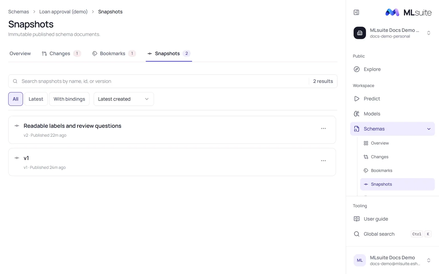 The Snapshots tab listing v2, Readable labels and review questions, and v1.
